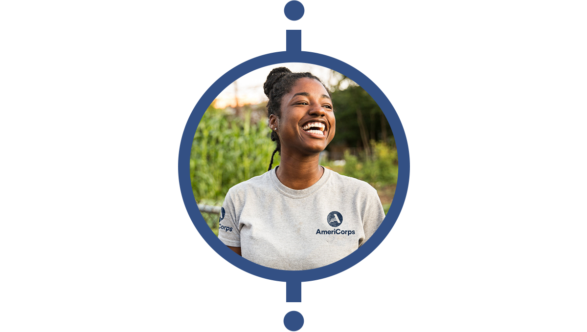 woman in americorps t-shirt smiling