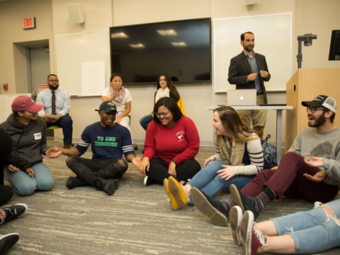 students sit in a circle