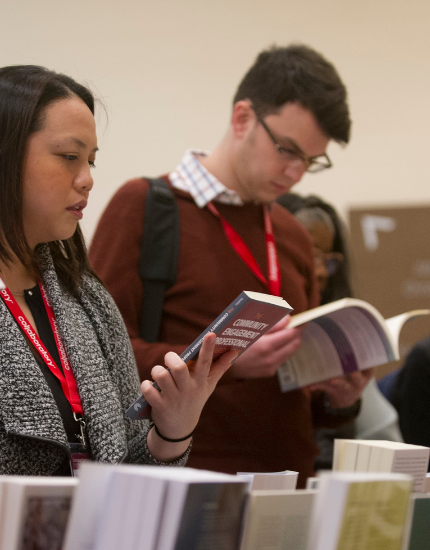 conference attendees browsing books